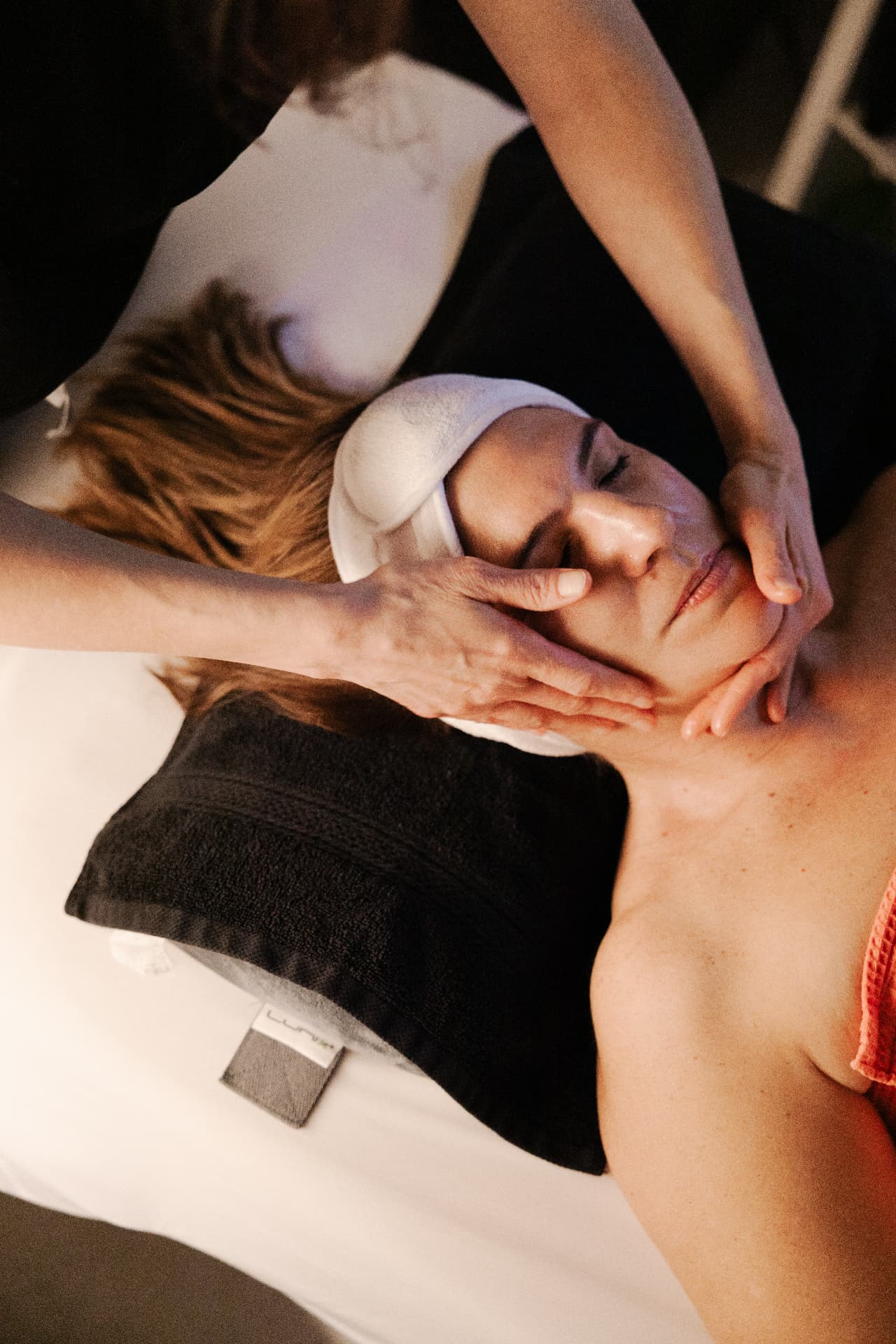 A provider performing a facial treatment